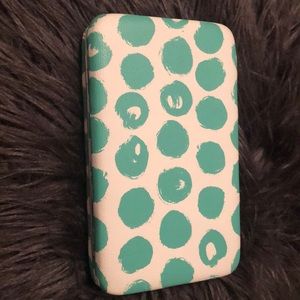 A teal and white polkadot pocketbook 😘